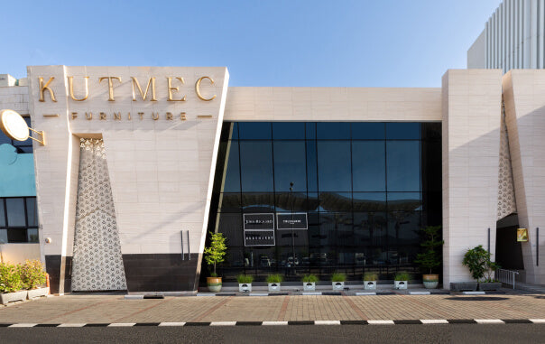 KUTMEC building exterior with glass facade and decorative elements
