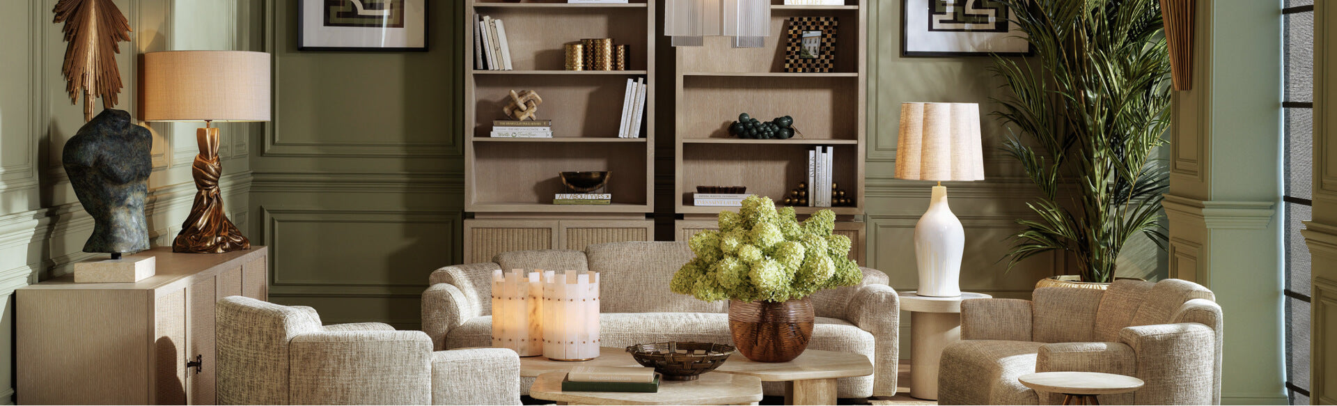 Living room with beige furniture, decorative items, and a lamp.