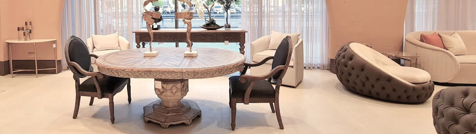 Furniture set including a round table and chairs in a living room setting.