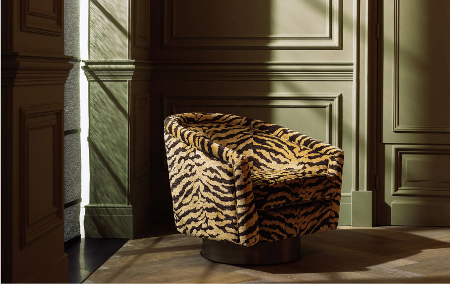 Zebra-patterned chair in a room with paneled walls and sunlight filtering through.